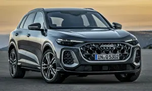 Nowoczesny Audi Q5 w ciemnym kolorze, z charakterystycznym grillem i światłami LED. Sprawdź aktualną audi q5 cena.