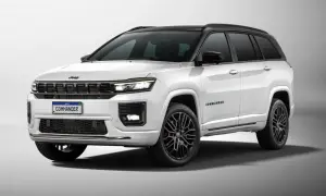 Biały Jeep Commander z czarnym dachem i przyciemnianymi szybami, na czarnych felgach.