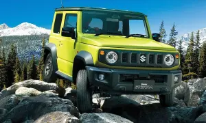 Żółty Suzuki Jimny 2026 pokonuje skalisty teren, gotowy na przygodę w górach.