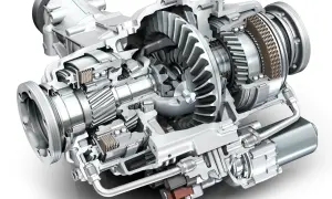 Przekrój mechanizmu dyferencjału z widocznymi zębatkami, łożyskami i elementami sterującymi.