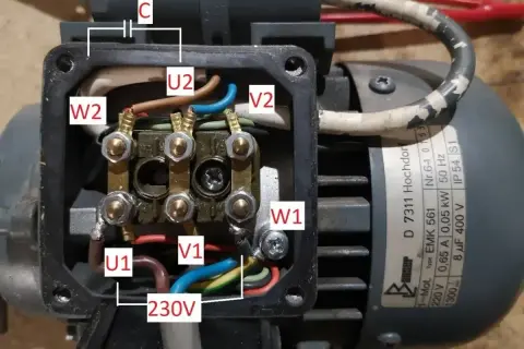 Schemat podłączenia silnika 3 fazowego do 230V, pokazujący jak zmienić obroty silnika przez odpowiednie połączenie uzwojeń U1, V1, W1 i U2, V2, W2 z kondensatorem C.