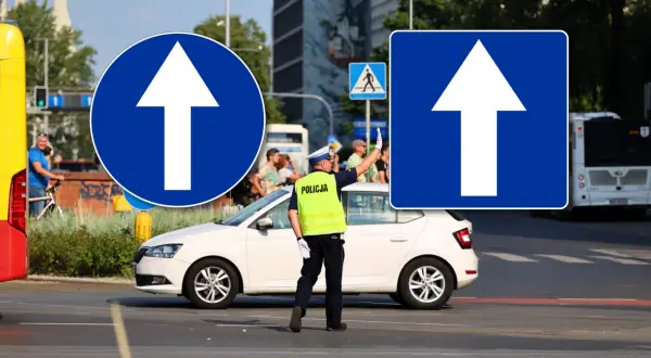 Policjant kieruje ruchem pod znakiem D3 nakazującym jazdę prosto.
