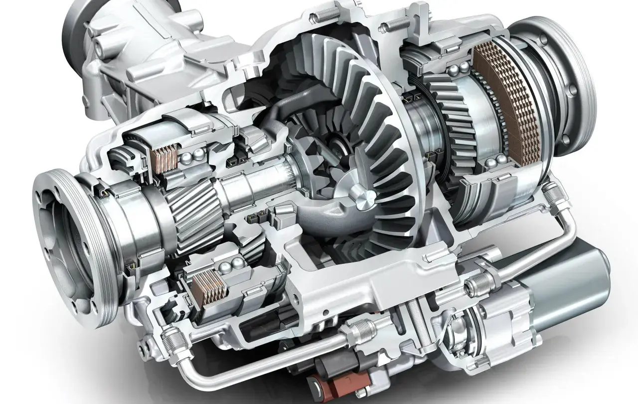 Przekrój mechanizmu dyferencjału z widocznymi zębatkami, łożyskami i elementami sterującymi.